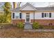 Front entrance with decorative metal railing, shrubs, and a walkway leading to the door at 3819 Centergrove Rd, Concord, NC 28025