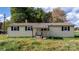 Yellow ranch home with a grey roof and front porch at 3925 Phelps Rd, Vale, NC 28168