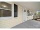 Front porch with new door and black shutters at 3925 Phelps Rd, Vale, NC 28168
