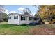 Side view of yellow ranch home with black shutters at 3925 Phelps Rd, Vale, NC 28168
