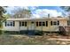 Yellow ranch home with black shutters and front porch at 3925 Phelps Rd, Vale, NC 28168