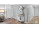 Bright entryway with wood floors and white console table at 3925 Phelps Rd, Vale, NC 28168