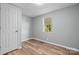 Simple bedroom with wood-look floors and a window at 3925 Phelps Rd, Vale, NC 28168