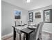 Bright dining area with a table set for four and gray chairs at 3925 Phelps Rd, Vale, NC 28168