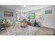 Living room with grey walls, wood floors, and comfy couch at 3925 Phelps Rd, Vale, NC 28168