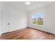 Simple bedroom with hardwood floors and a window offering a view at 108 Augusta Ln, Shelby, NC 28150