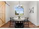 Charming dining area with a round table and four black chairs near a barn door at 108 Augusta Ln, Shelby, NC 28150