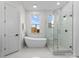 Modern bathroom with soaking tub, walk-in shower, and stylish vanity at 108 Augusta Ln, Shelby, NC 28150