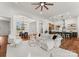 Open concept living room with white slipcovered furniture and views into kitchen and dining areas at 108 Augusta Ln, Shelby, NC 28150