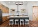Modern kitchen with light wood cabinets, a large island, and stainless steel appliances at 108 Augusta Ln, Shelby, NC 28150