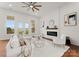 Bright and airy living room with white furniture, fireplace, and access to balcony at 108 Augusta Ln, Shelby, NC 28150