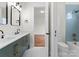 Modern bathroom with double vanity, blue tile, and bathtub at 108 Augusta Ln, Shelby, NC 28150