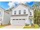 Two-story house with white siding, gray trim, and a two-car garage at 1027 Freeman View Dr # 151P, Albemarle, NC 28001