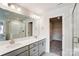 Double vanity bathroom with a walk-in shower and separate closet at 14917 Tamarack Dr, Charlotte, NC 28278