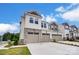 Two-story townhome with two-car garage and stone accents at 14917 Tamarack Dr, Charlotte, NC 28278