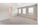 Upstairs bedroom with neutral carpeting and window at 14917 Tamarack Dr, Charlotte, NC 28278