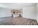 Open concept kitchen with island and gray cabinets at 14917 Tamarack Dr, Charlotte, NC 28278