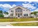 Two-story house with stone accents and a landscaped lawn at 14917 Tamarack Dr, Charlotte, NC 28278