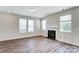 Spacious living room with hardwood floors and a fireplace at 14917 Tamarack Dr, Charlotte, NC 28278