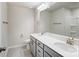 Modern bathroom with double vanity, large mirror, and shower at 14917 Tamarack Dr, Charlotte, NC 28278