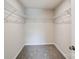 Walk-in closet with wire shelving for ample storage at 14917 Tamarack Dr, Charlotte, NC 28278