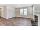 Bright living room featuring hardwood floors and a fireplace at 14917 Tamarack Dr, Charlotte, NC 28278