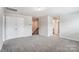 Spacious bedroom with carpet, double door closet and access to bathroom at 14917 Tamarack Dr, Charlotte, NC 28278