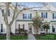 Inviting exterior of a two-story townhome with landscaping and walkway at 4211 Center Place Dr, Harrisburg, NC 28075