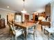 Kitchen and dining area with wood cabinets and tiled floor at 4909 Pleasant Grove Rd, Waxhaw, NC 28173