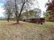 Brick ranch house with mature trees and landscaping at 4909 Pleasant Grove Rd, Waxhaw, NC 28173