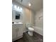 Updated bathroom with marble tile and modern vanity at 6848 N Ridge Ct, Charlotte, NC 28215