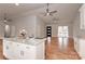 Open concept kitchen with island and hardwood floors, offers modern appliances at 105 Pelican Ct, Mooresville, NC 28117