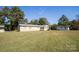 Spacious backyard with a mobile home, shed, and grassy area at 961 Shallowbrook Dr, Chester, SC 29706