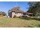 Side view of brick ranch house, showcasing yard and landscaping at 961 Shallowbrook Dr, Chester, SC 29706