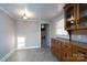 Dining area with wood cabinets and view into kitchen at 24947 Nc 24/27 Hwy, Albemarle, NC 28001