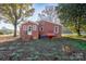 Brick rancher house with steps and a propane tank in the backyard at 24947 Nc 24/27 Hwy, Albemarle, NC 28001