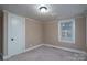 Well-lit bedroom with neutral walls and carpet flooring at 24947 Nc 24/27 Hwy, Albemarle, NC 28001
