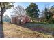 Back of brick ranch house with steps and a storage tank at 24947 Nc 24/27 Hwy, Albemarle, NC 28001