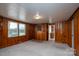 Bonus room with wood paneled walls and carpeted floor at 24947 Nc 24/27 Hwy, Albemarle, NC 28001