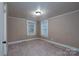 Spacious bedroom with neutral walls and carpet flooring at 24947 Nc 24/27 Hwy, Albemarle, NC 28001