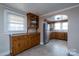 Kitchen with wood cabinets and a view into dining area at 24947 Nc 24/27 Hwy, Albemarle, NC 28001