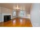 Bright living room with hardwood floors and a fireplace at 24947 Nc 24/27 Hwy, Albemarle, NC 28001