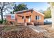 Brick ranch house with front steps and walkway, surrounded by autumn leaves at 24947 Nc 24/27 Hwy, Albemarle, NC 28001