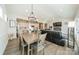 Bright dining area with a large table and chandelier at 5014 Painswick Pl, Charlotte, NC 28215