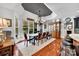 Bright dining room with hardwood floors, large windows, and a chandelier at 4628 River Oaks Rd, Clover, SC 29710