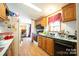 Galley kitchen with wood cabinets, and appliances at 1668 Lane Rd, Mount Holly, NC 28120