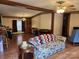 Living room with floral couch and wood accent table at 1668 Lane Rd, Mount Holly, NC 28120