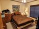 Bright bedroom with wood dresser and double bed at 1668 Lane Rd, Mount Holly, NC 28120