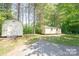 Two separate storage sheds in the backyard at 1668 Lane Rd, Mount Holly, NC 28120