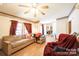 Living room with L-shaped sofa and wood flooring at 1668 Lane Rd, Mount Holly, NC 28120